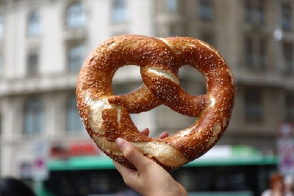 person holding a pretzel