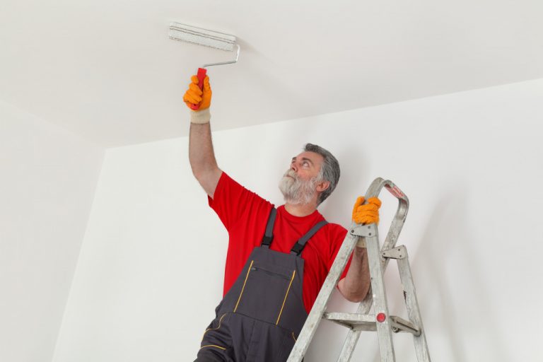 man painting the ceiling