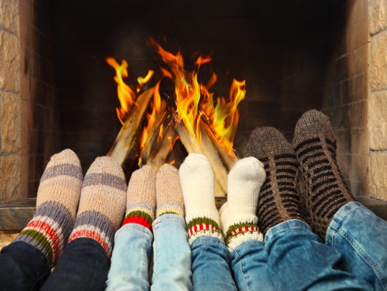 people warming their feet