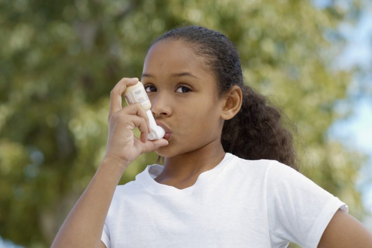 girl using an inhaler