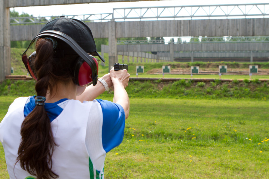 Woman shooting in shooting range