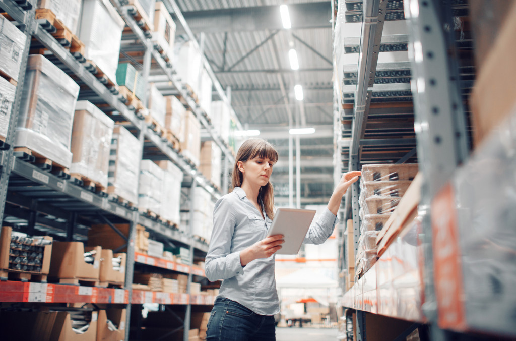 woman doing warehouse inventory