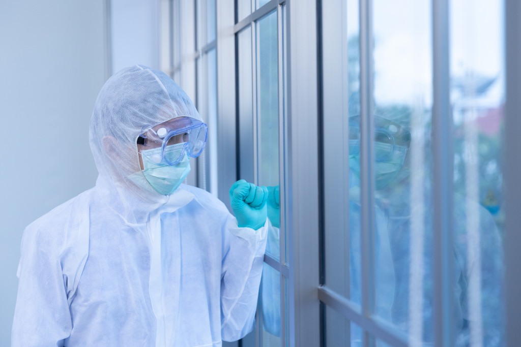 scientist wearing PPE in lab coronavirus pandemic