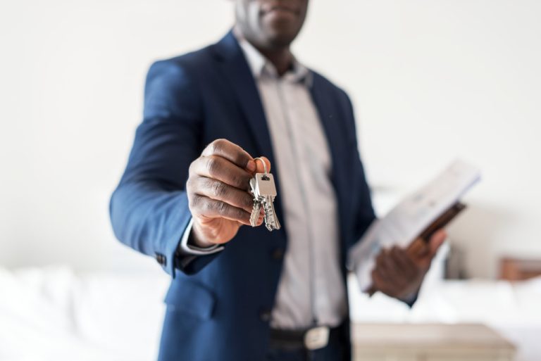 real estate agent handing house keys